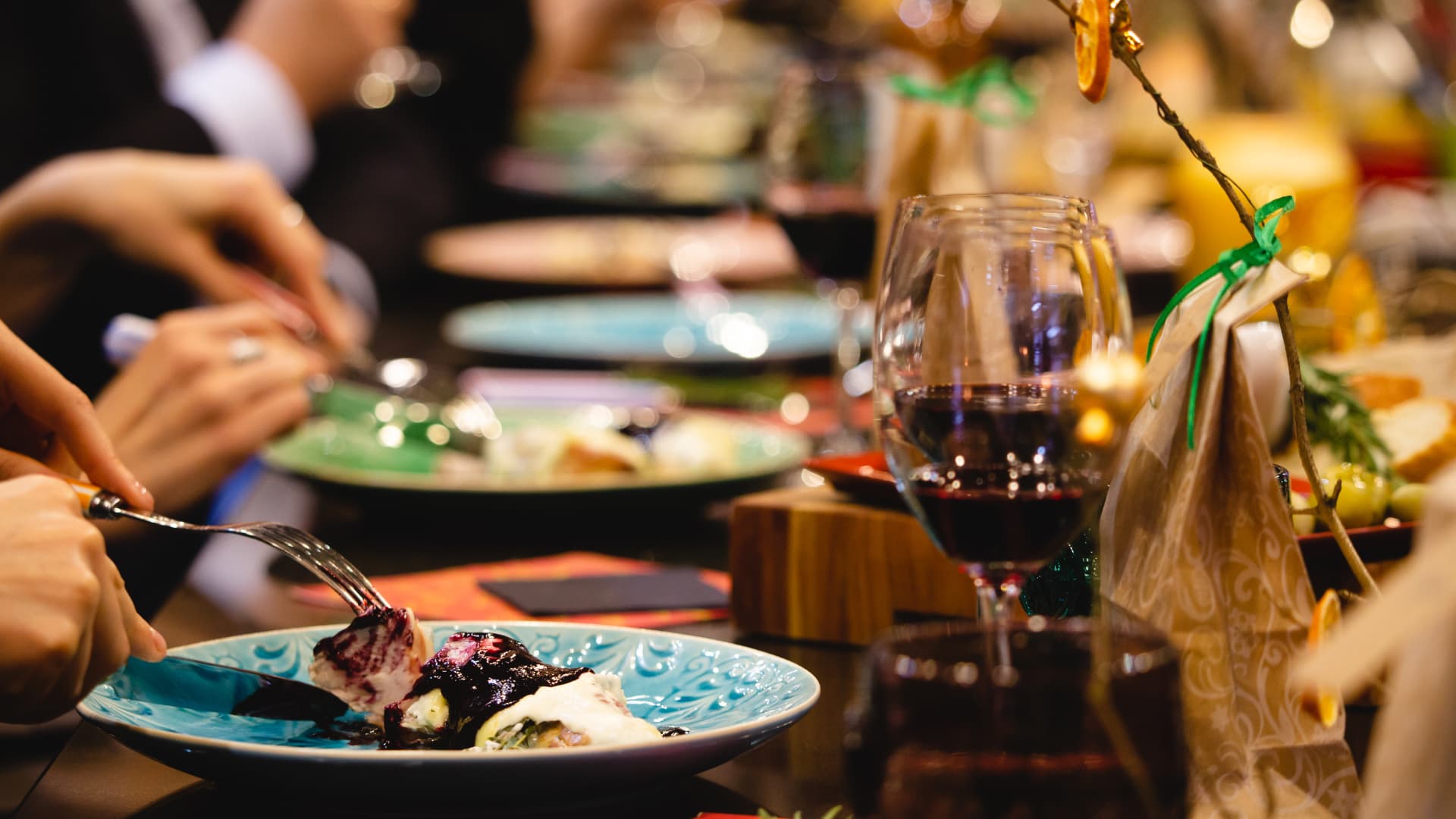 Guests enjoy their food. An image of guests at a fine dining establishment.