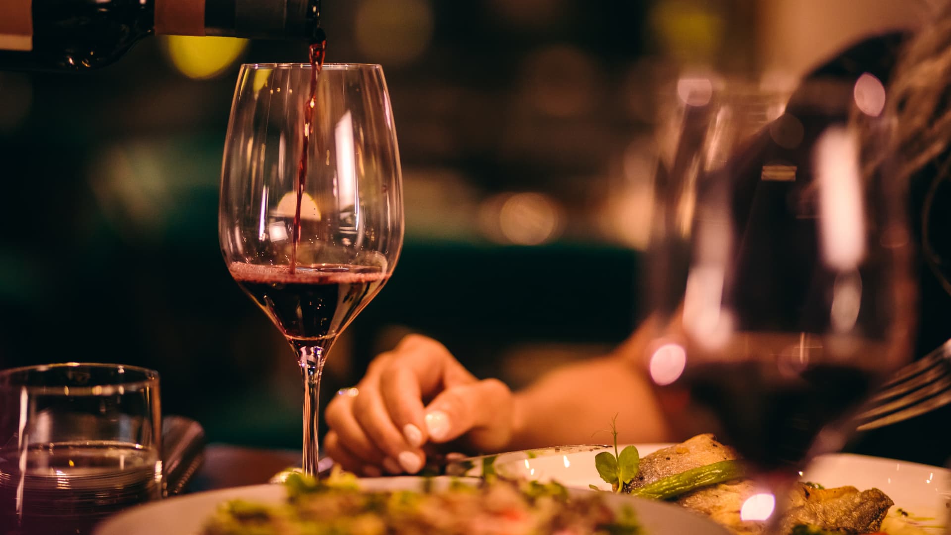 Wine being served. High-end red wine being served in a fine dining establishment.